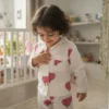 Red buffalo print kids night suit candid shot, playful and comfortable sleepwear
