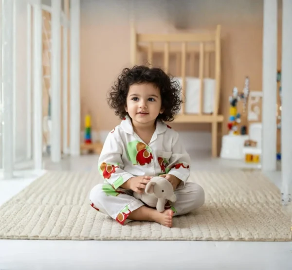 Green elephant print kids night suit indoor shot, relaxed and cozy sleepwear