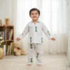 Green giraffe print kids night suit smiling front view, cheerful and comfortable sleepwear