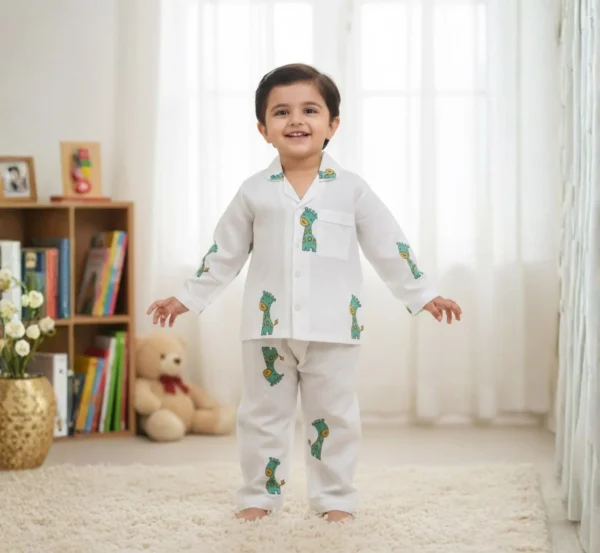 Green giraffe print kids night suit smiling front view, cheerful and comfortable sleepwear