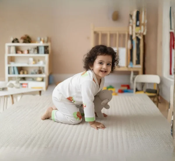 Green elephant print kids night suit playful pose, fun and comfortable sleepwear