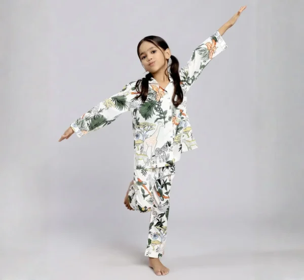 Kids white jungle print cotton night suit playful pose, fun and comfortable kids sleepwear