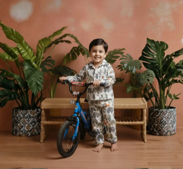 Multi elephant print kids night suit standing pose, cozy and breathable sleepwear