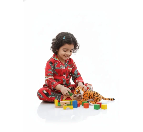 Red jungle print kids night suit playful pose, fun and comfortable sleepwear