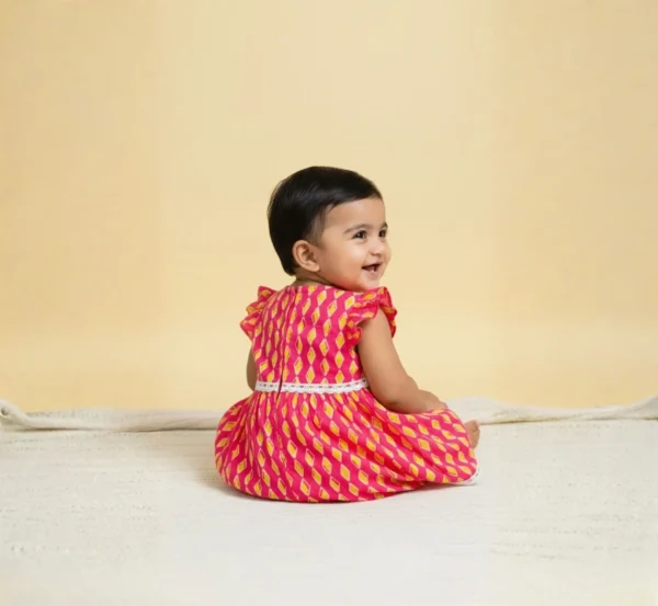 Rani pink cotton infant frock back view, soft and comfortable baby outfit
