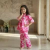 Pink floral girls cotton co-ord set playful pose, fun and flexible outfit for kids