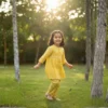 Yellow girls cotton co-ord set lifestyle candid shot, relaxed and breathable outfit