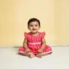 Rani pink cotton baby frock front view, soft and comfortable outfit for infants