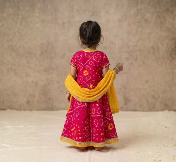 Fuschia Bandhej Lehenga Choli for girls back view with yellow dupatta