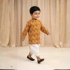 Mustard Dhoti Kurta for boys walking view with printed kurta and dhoti