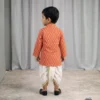 Orange Dhoti Kurta for boys back view showing printed kurta and white dhoti